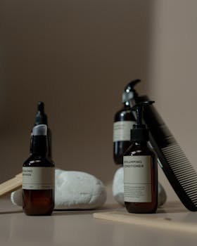 Luxurious display featuring brown bottles of hair care products against a neutral backdrop. Perfect for beauty branding.